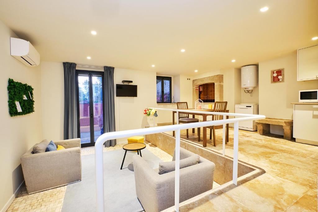 a living room with a dining room and a kitchen at Sintra Bliss A Part in Sintra