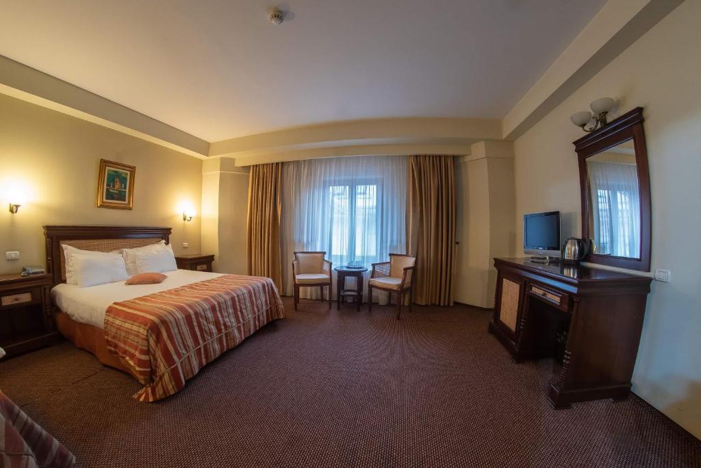 Postel nebo postele na pokoji v ubytování Atrium Hotel Ateneu City Center