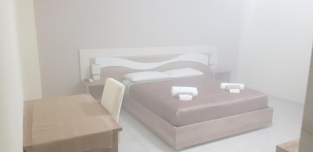 Postel nebo postele na pokoji v ubytování B&B AEREOSTATION