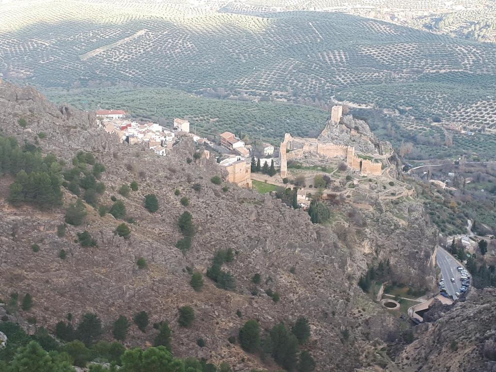 a town on top of a mountain at Casa Rural Castillo LA Iruela in La Iruela