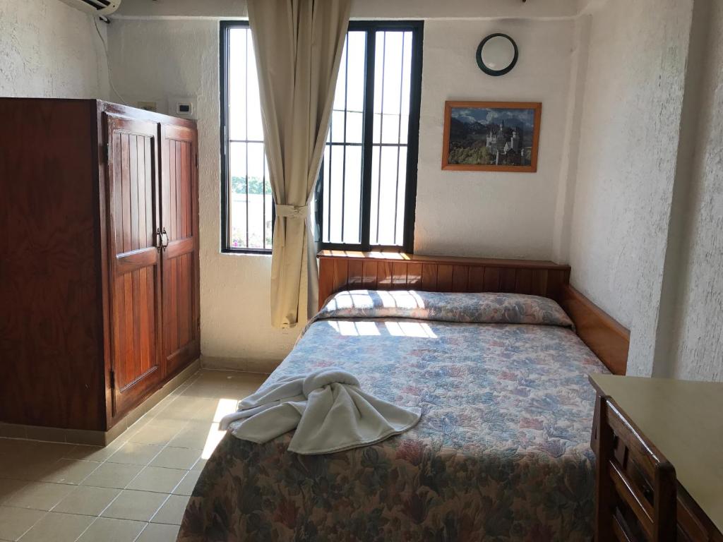 Postel nebo postele na pokoji v ubytování Arcos hotel
