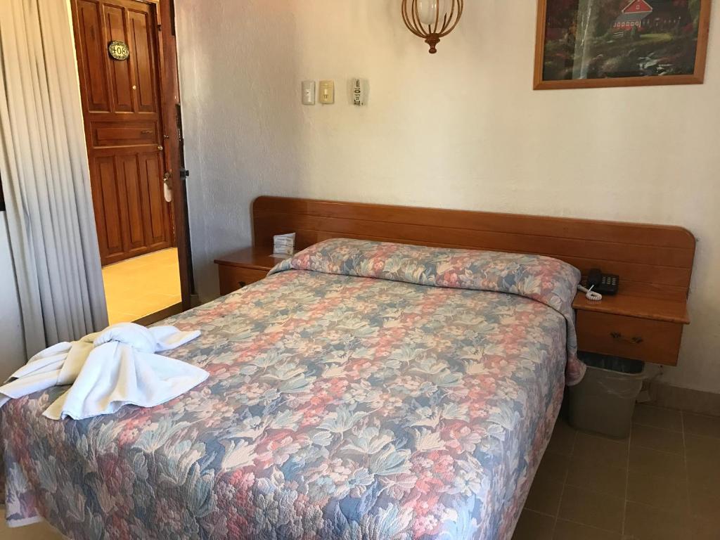 Postel nebo postele na pokoji v ubytování Arcos hotel