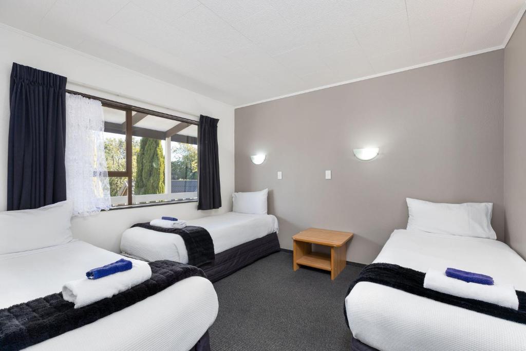Postel nebo postele na pokoji v ubytování Kings Gate Motel
