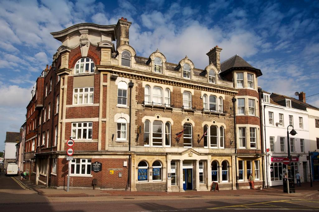 a building with a clock on the front of it at The Crown Hotel in Weymouth