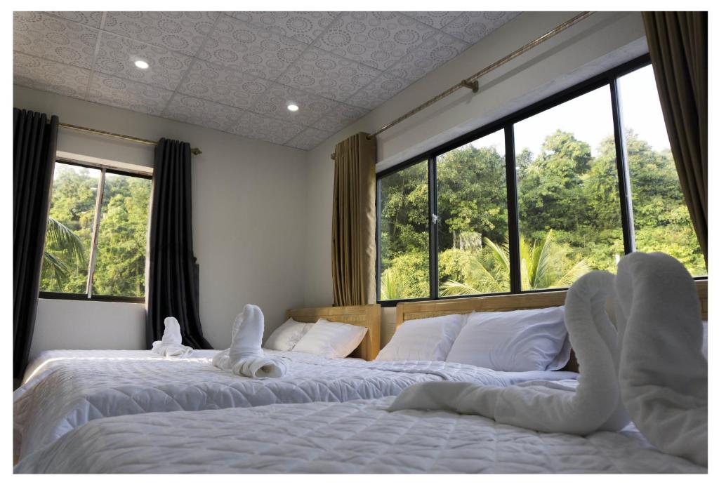 Postel nebo postele na pokoji v ubytování Chamisland Hanhly homestay