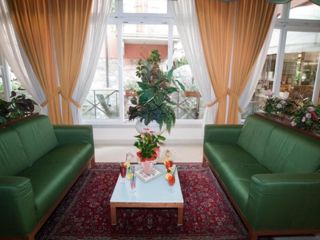 Posezení v ubytování Hotel Villa Mulino ***S