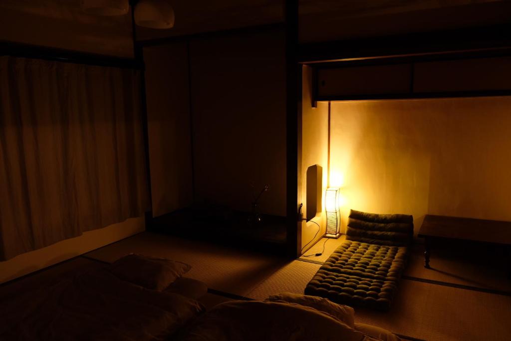 Postel nebo postele na pokoji v ubytování Guesthouse SHIGI