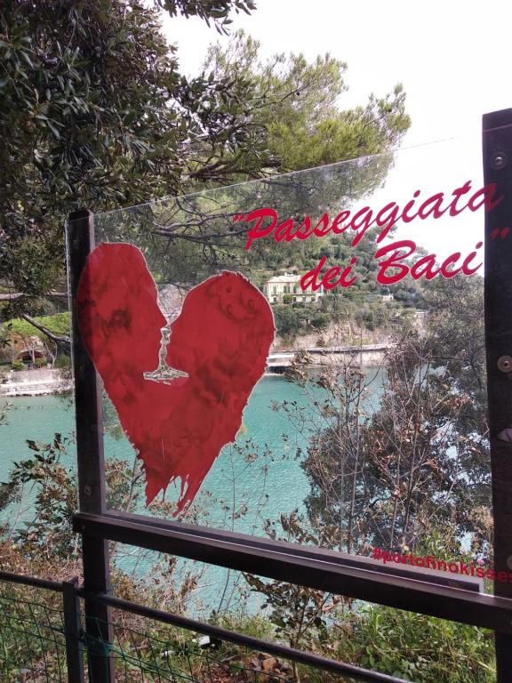 a sign with a red heart on a fence at La Casetta - Near the sea & free parking in Rapallo