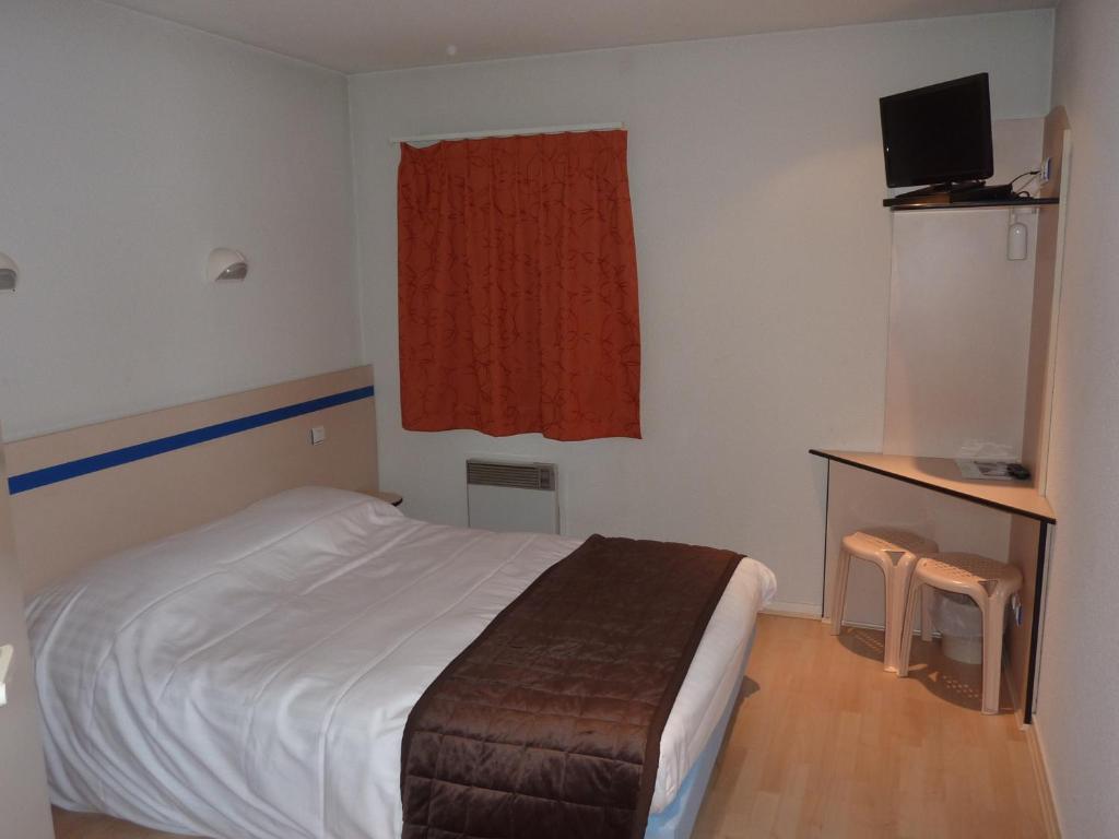 TV a/nebo společenská místnost v ubytování Lac'Hotel France