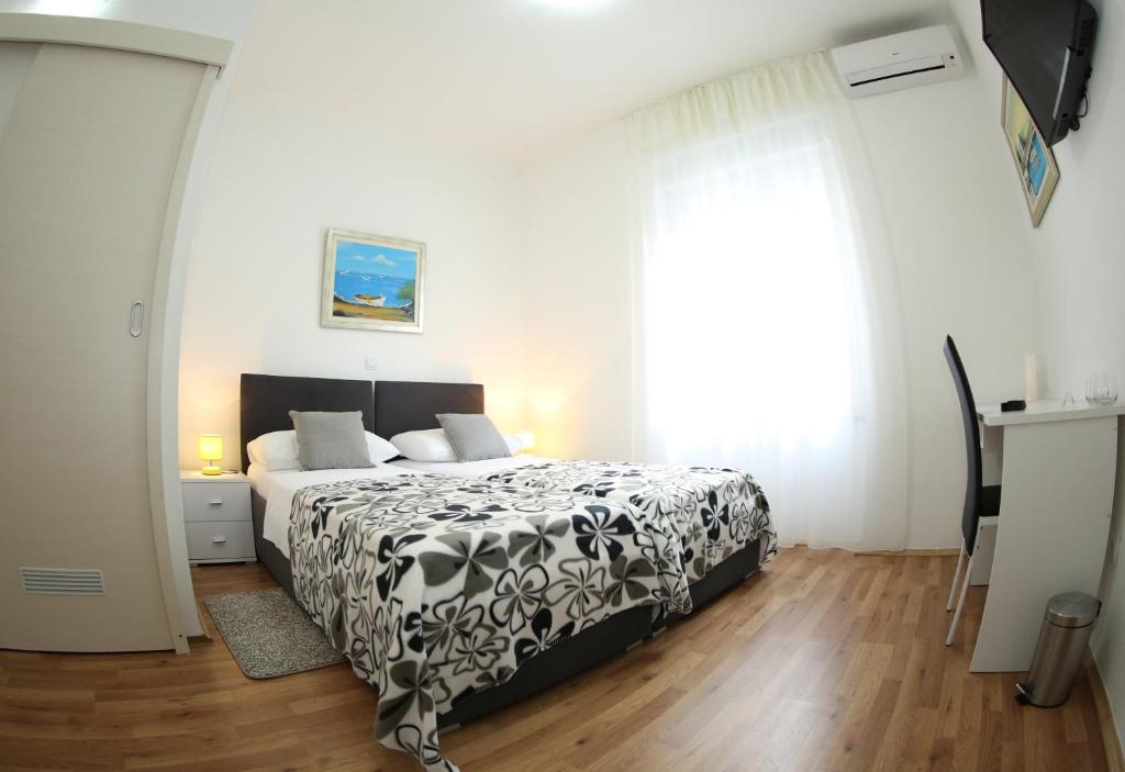 Postel nebo postele na pokoji v ubytování A&M Apartment and Rooms