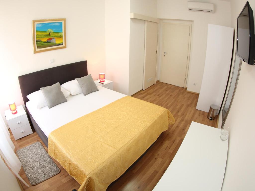 Postel nebo postele na pokoji v ubytování A&M Apartment and Rooms