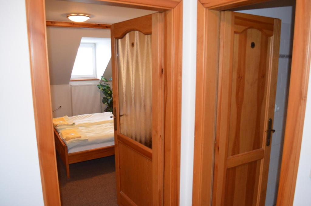 Postel nebo postele na pokoji v ubytování Hotel Na Statku