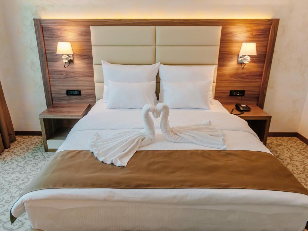Letto o letti in una camera di Hotel New Star