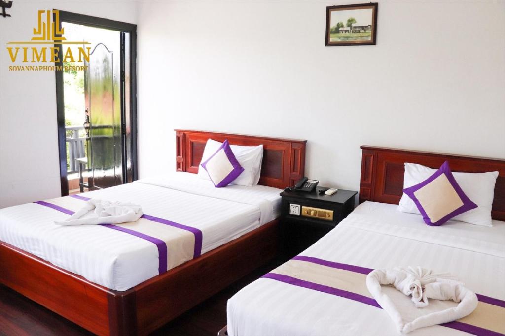Postel nebo postele na pokoji v ubytování Vimean Sovannaphoum Resort