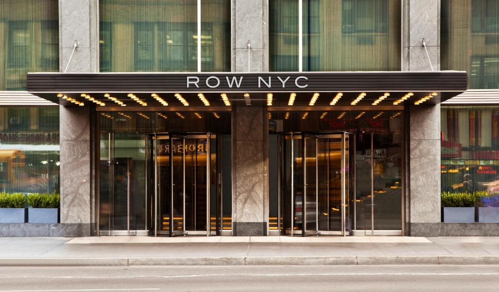 a building with a row of revolving doors at Row NYC at Times Square in New York