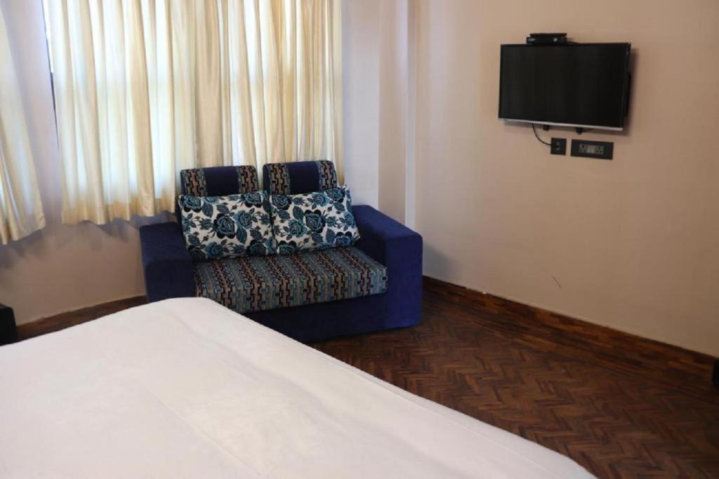 TV a/nebo společenská místnost v ubytování Rinchen Hotel