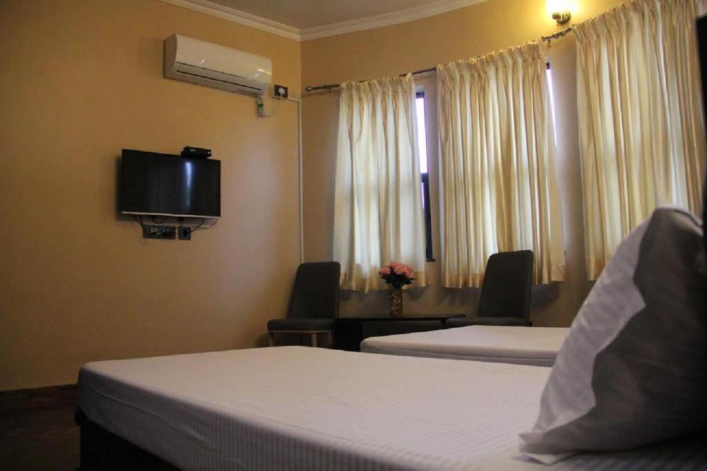 TV a/nebo společenská místnost v ubytování Rinchen Hotel