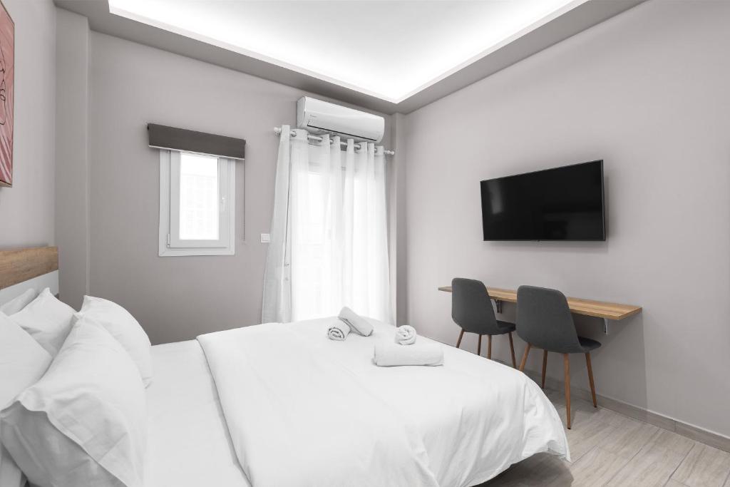 Łóżko lub łóżka w pokoju w obiekcie Lausanne, Nilie Hospitality MGMT