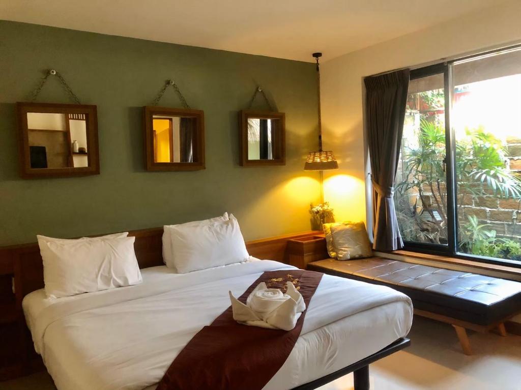 Postel nebo postele na pokoji v ubytování Ploy Resort