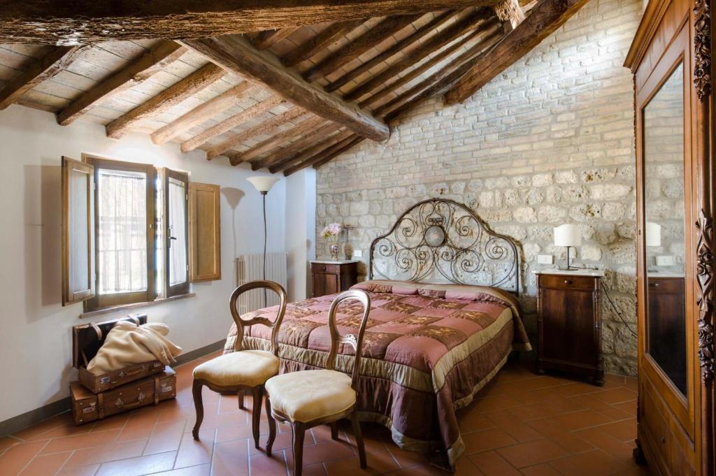 Llit o llits en una habitació de B&B San Gimignano Diffuso
