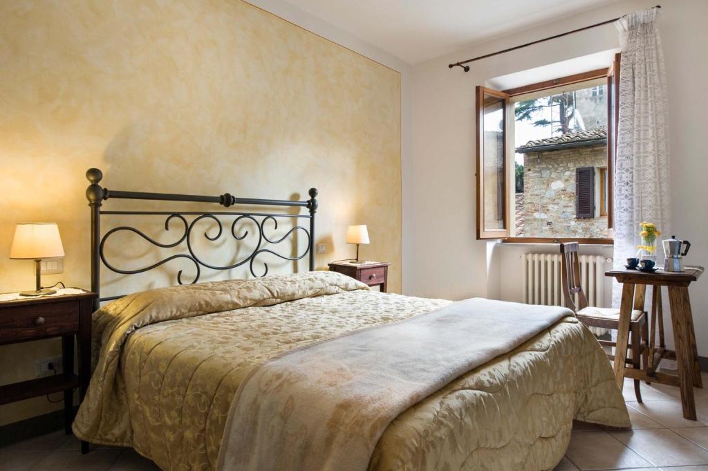 Llit o llits en una habitació de B&B San Gimignano Diffuso