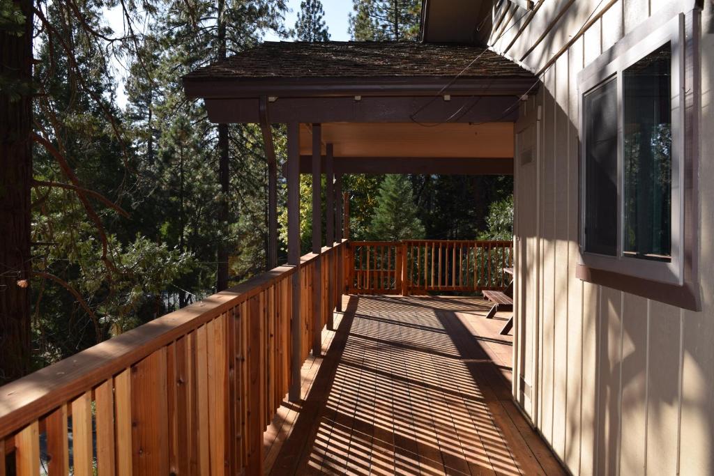 a wooden walkway leading to a porch on a house at 11B Sequoia House in Wawona