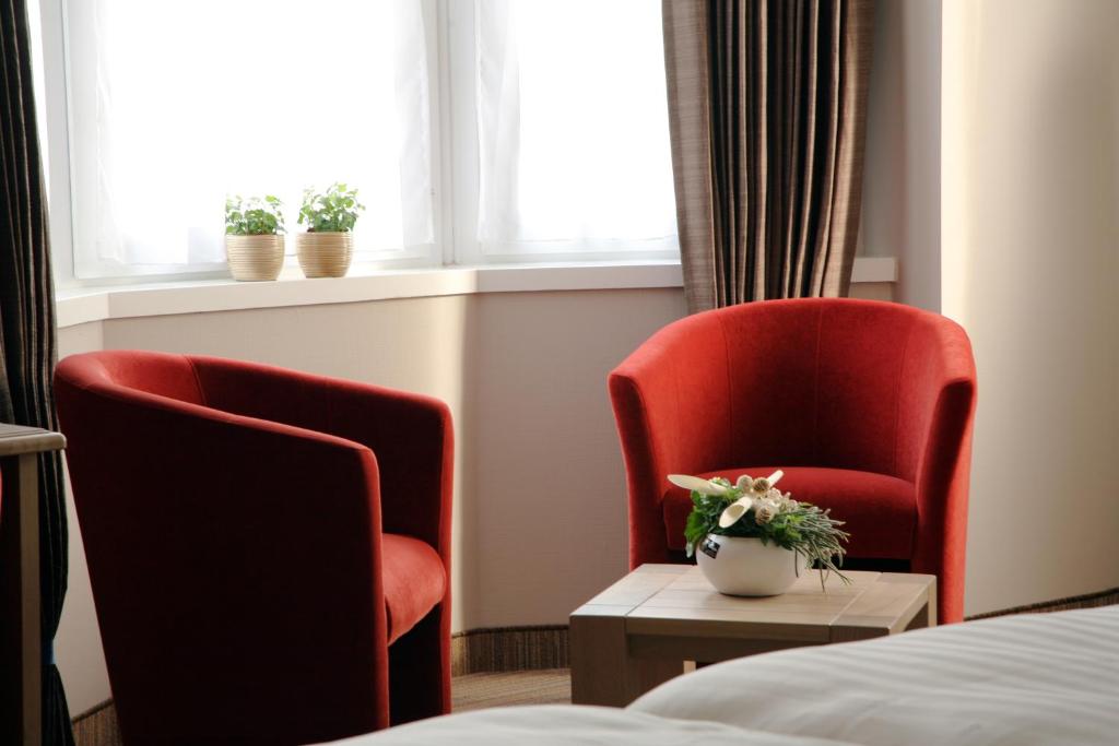 Posezení v ubytování Ambassador Hotel