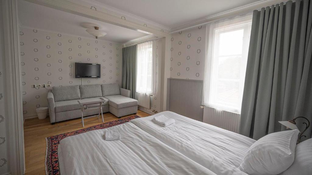 Postel nebo postele na pokoji v ubytování Lundsbrunn Resort & Spa