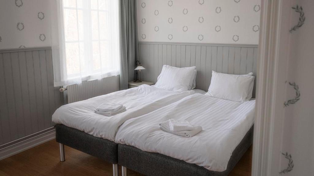 Postel nebo postele na pokoji v ubytování Lundsbrunn Resort & Spa