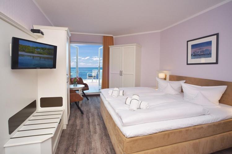 Postel nebo postele na pokoji v ubytování Hotel Wilhelmshöhe