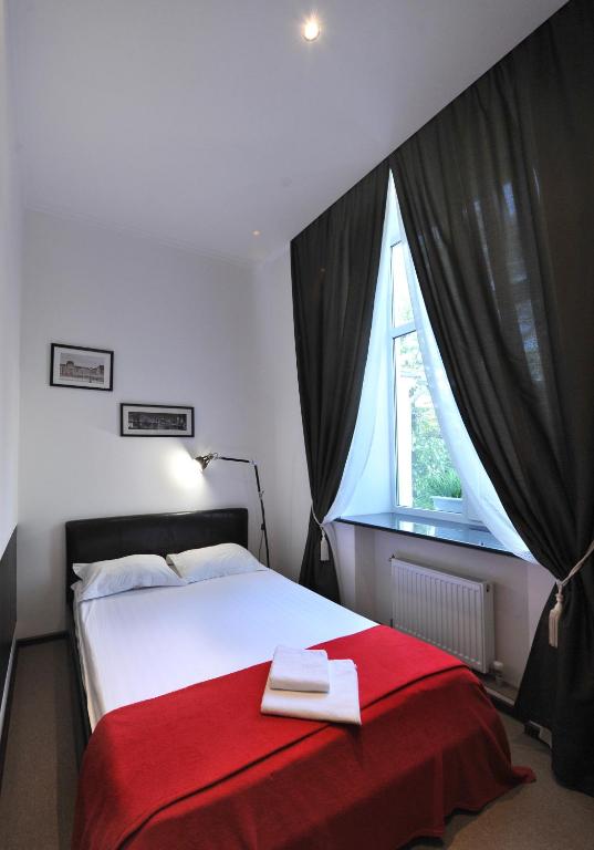 Postel nebo postele na pokoji v ubytování Reno Hotel