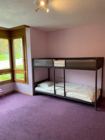 Postel nebo postele na pokoji v ubytování Luxury family apartment Engelberg