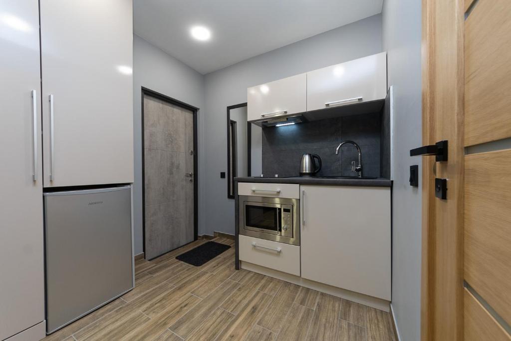 Kuchyň nebo kuchyňský kout v ubytování Tomas apartments