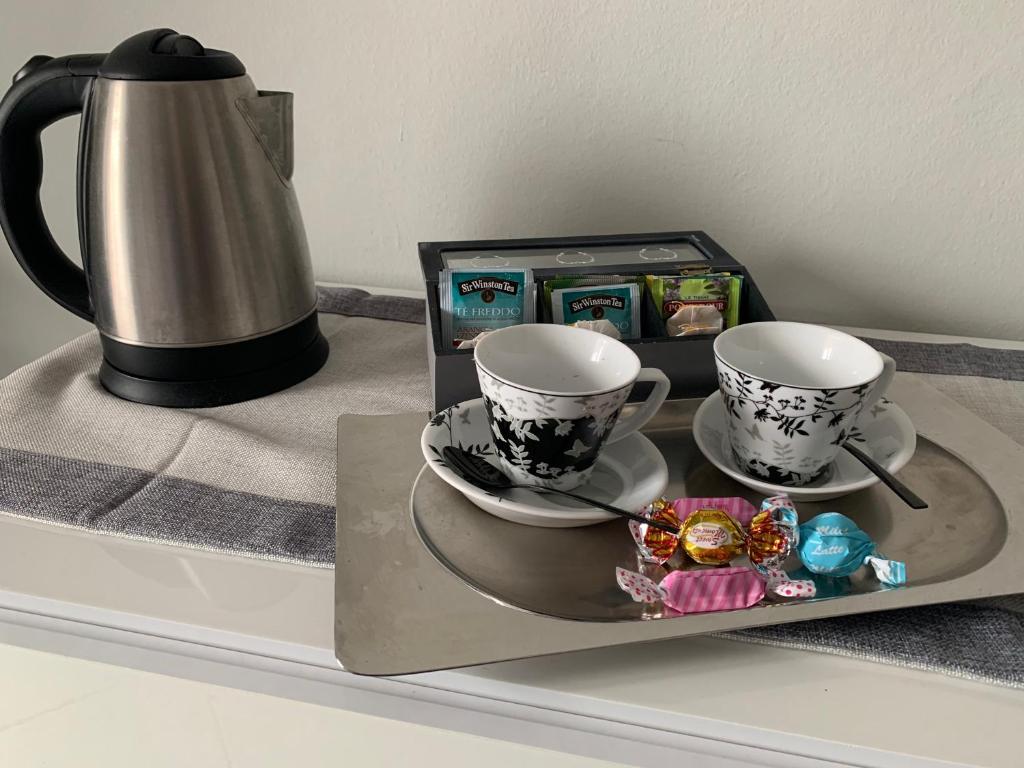 Coffee and tea making facilities at Appartamento nel cuore di Arona - box privato