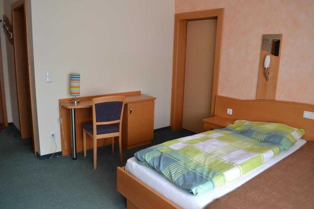 Postel nebo postele na pokoji v ubytování Gasthof s'Schatzkastl