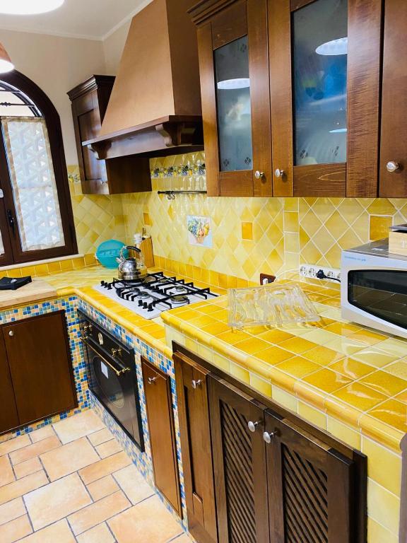 A kitchen or kitchenette at Villa Grisì
