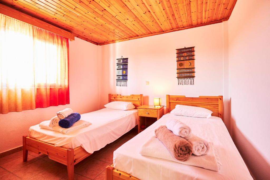 Postel nebo postele na pokoji v ubytování Nerida Beachfront Villas