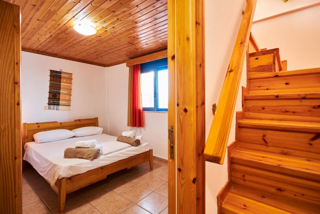 Postel nebo postele na pokoji v ubytování Nerida Beachfront Villas
