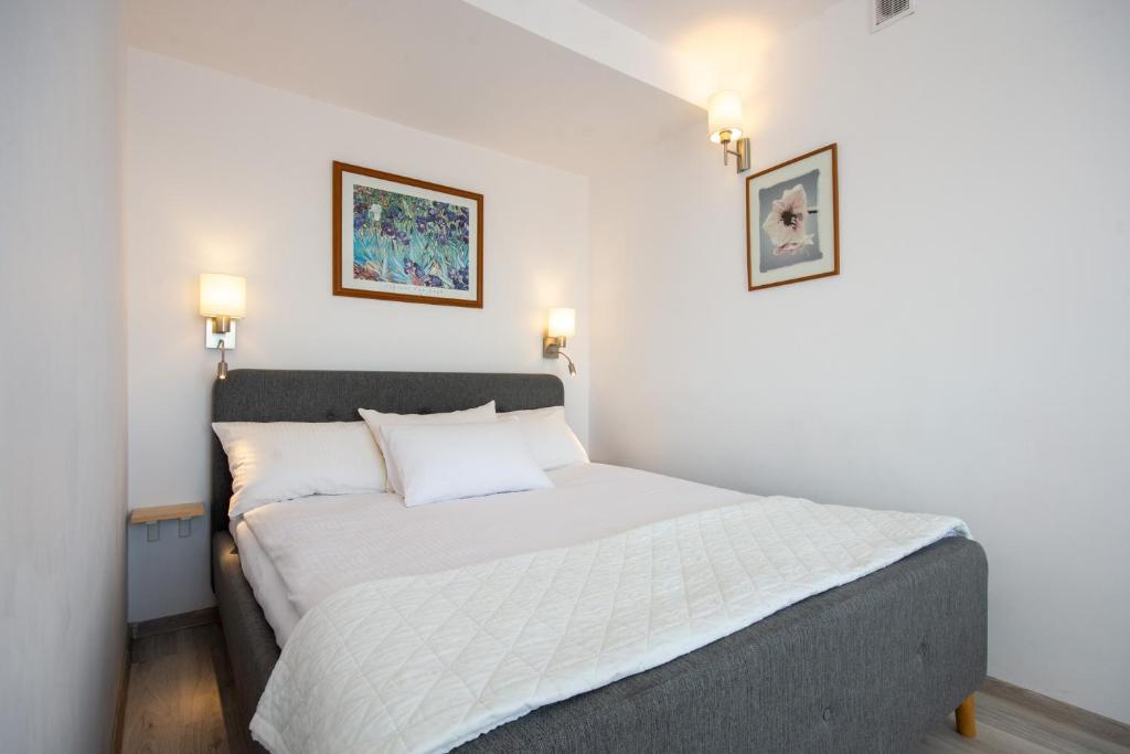Postel nebo postele na pokoji v ubytování Hotel Jan