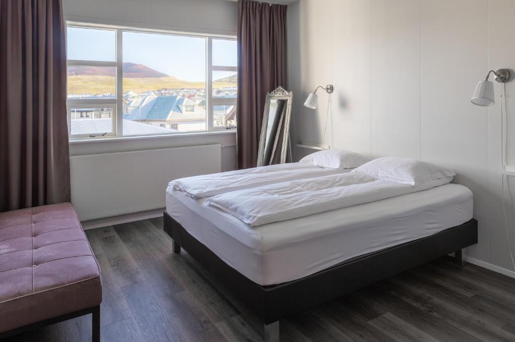 Postel nebo postele na pokoji v ubytování Guesthouse Hamar