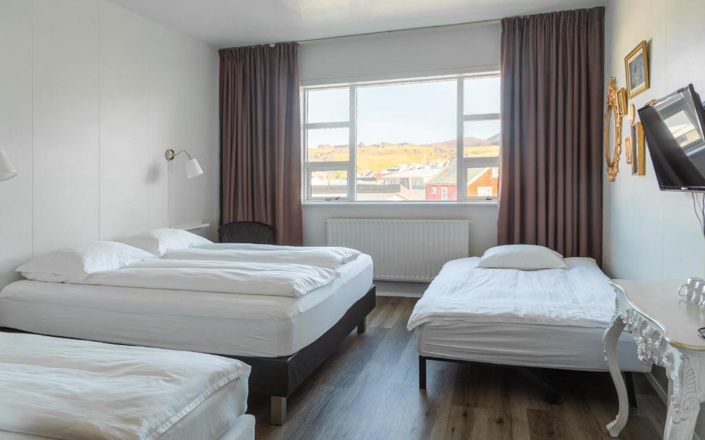 Postel nebo postele na pokoji v ubytování Guesthouse Hamar