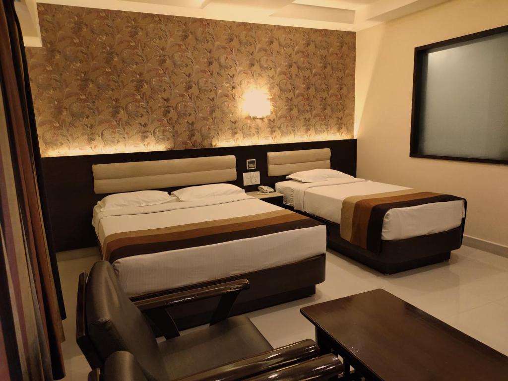 Postel nebo postele na pokoji v ubytování Hotel Deepam