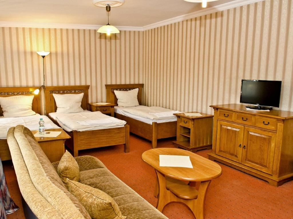 Posteľ alebo postele v izbe v ubytovaní Hotel Janków