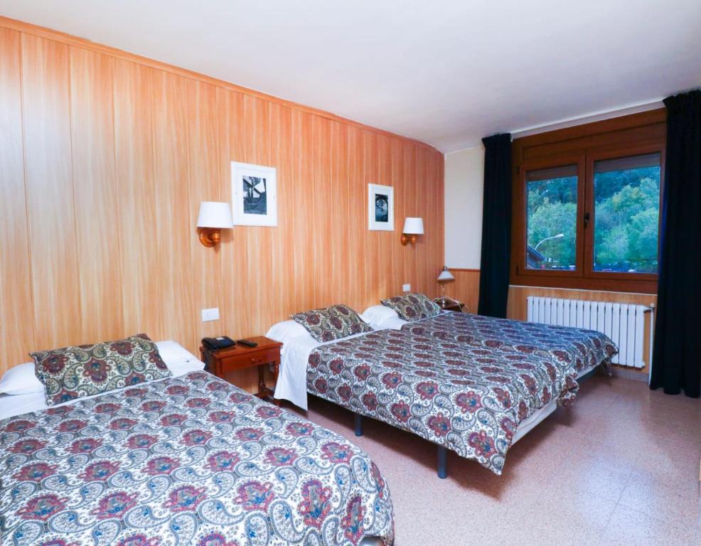 Postel nebo postele na pokoji v ubytování Hotel Comapedrosa