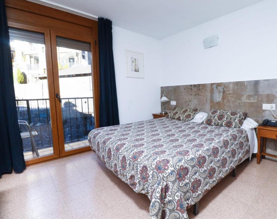 Postel nebo postele na pokoji v ubytování Hotel Comapedrosa
