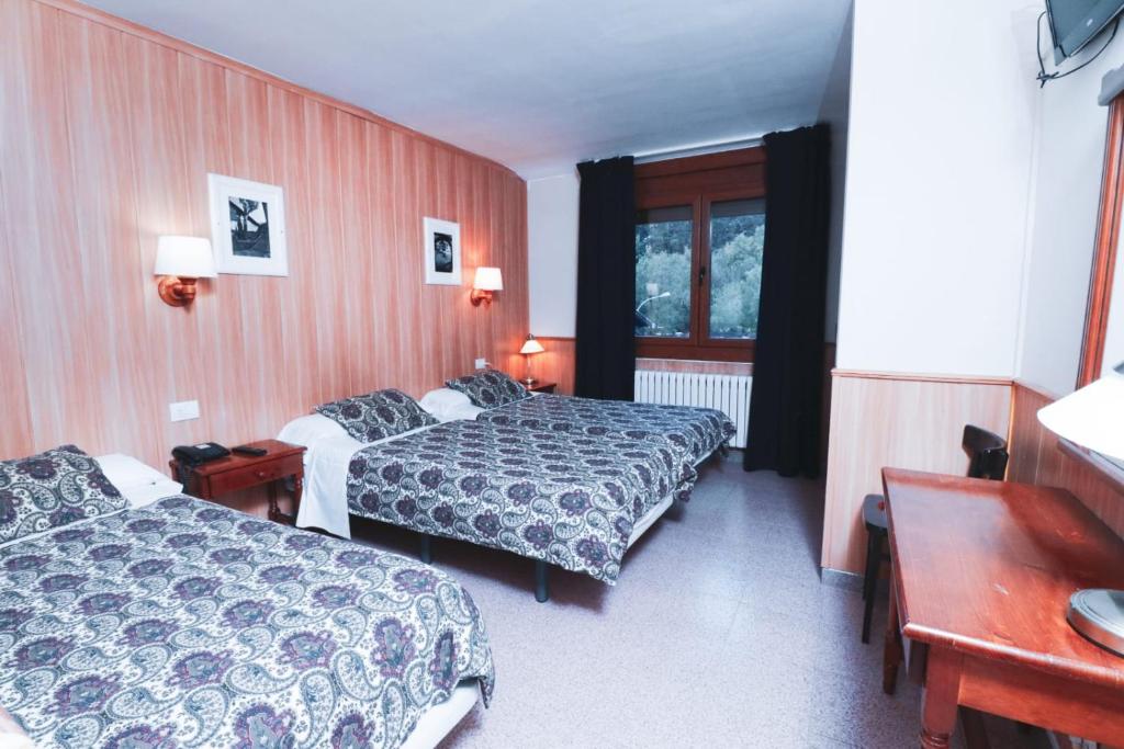 Postel nebo postele na pokoji v ubytování Hotel Comapedrosa