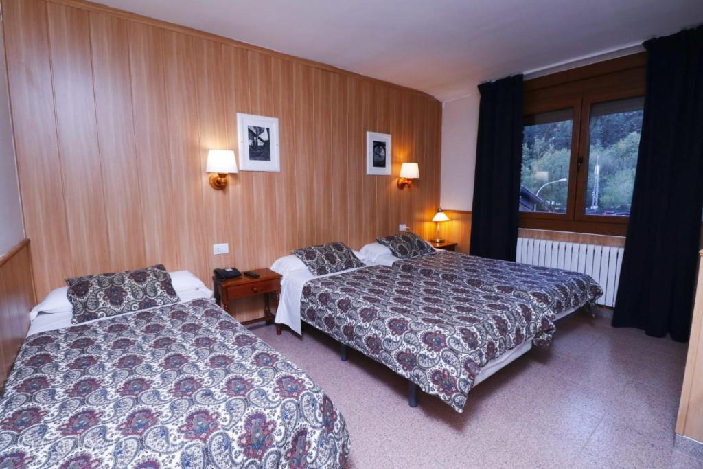 Postel nebo postele na pokoji v ubytování Hotel Comapedrosa