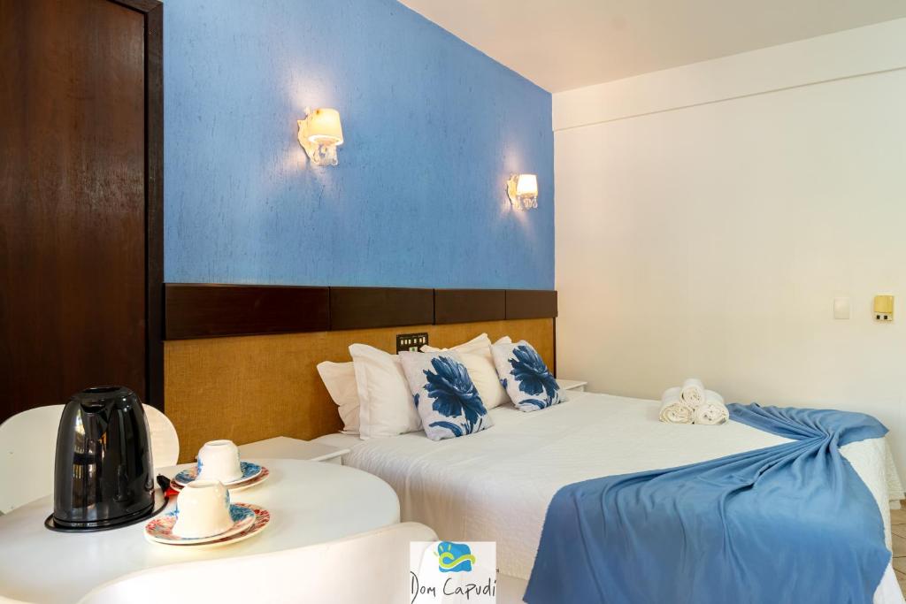 Cama ou camas em um quarto em Pousada Dom Capudi