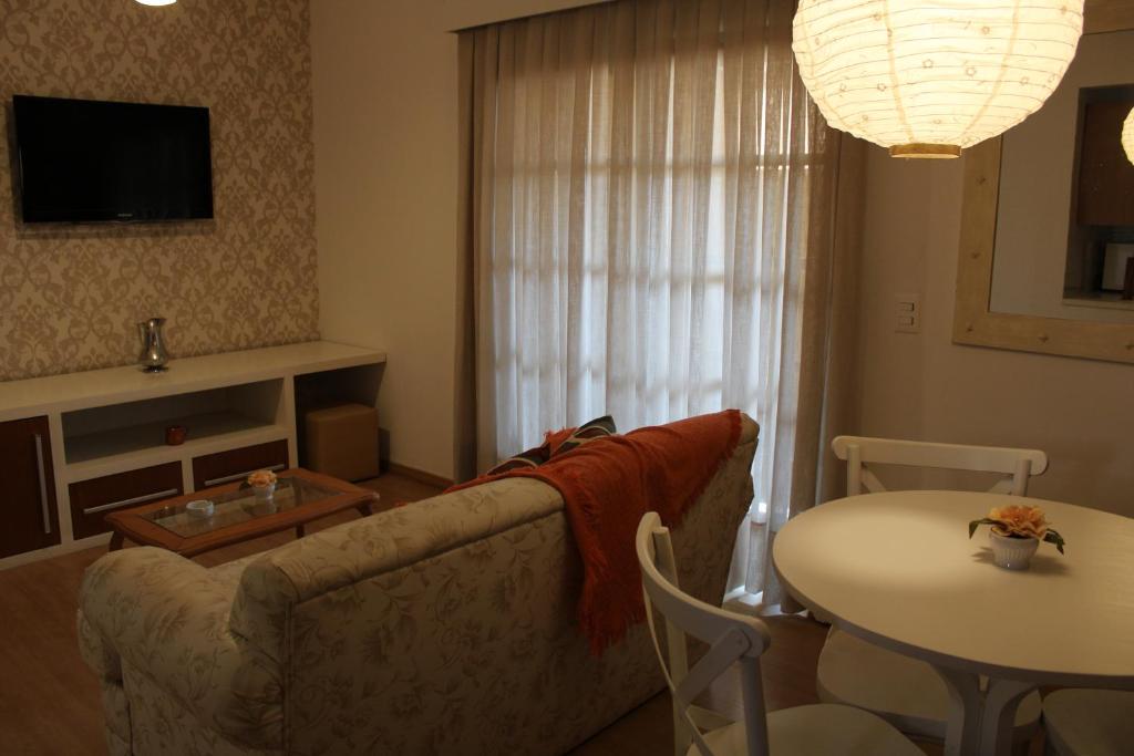 Uma TV ou centro de entretenimento em Pousada Dom Capudi