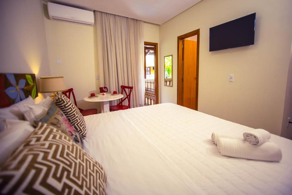 Cama ou camas em um quarto em Pousada Dom Capudi